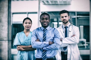 Portrait of nurse and doctor with businessman