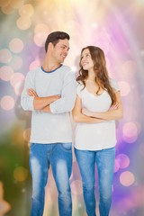 Wall Mural - Composite image of happy couple standing with arms crossed