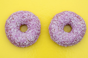 candy donuts isolated on yellow background