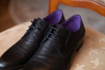 Canvas Print - Black shoes on a chair. Wedding day.