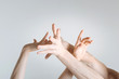© zinkevych - Delicate athletes hands demonstrating interaction in the studio