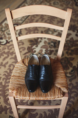 Poster - Men's shoes on the chair