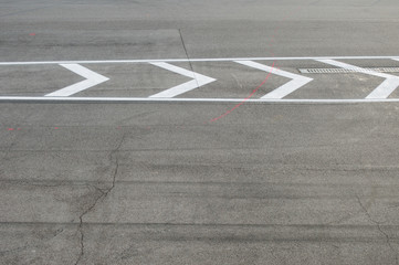 Texture of road with marking on an autodrome for high speed races. Day lighting and cloudy but sunny weather.