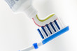 Toothbrush and toothpaste on blurred background with copy space