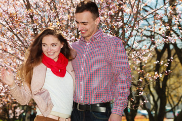 Couple in love walking in park at sunny spring day