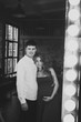 © Make_story Studio - Portrait of happy couple awaiting the birth of the baby in loft interior.