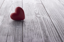 Red Heart On The White Painted Wooden Background