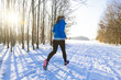 © markus_schelhorn - Blond woman is jogging in winter from right to left