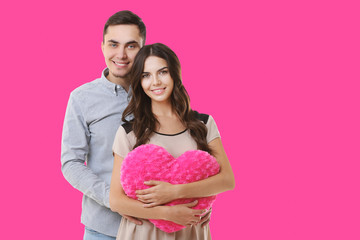 Sticker - Young couple with heart posing on color background