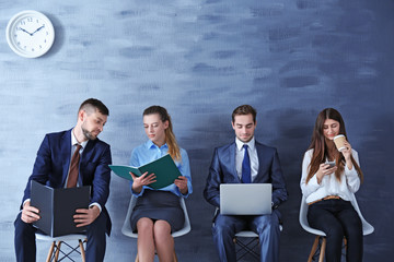 Sticker - Group of young people waiting for interview indoors