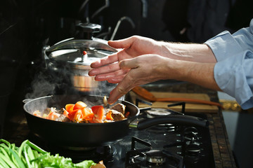 Wall Mural - Cooking meat with a vegetables