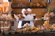 © JackF - Bakery staff offering bread