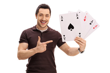 Canvas Print - Happy guy holding four aces and pointing