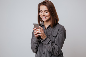 Sticker - Happy young lady using mobile phone.