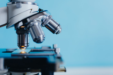 Wall Mural - powerful scientific laboratory microscope with multiple lenses.