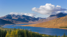 The Road To The Scottish Highlands Passing Loch Loyne And The Distant Mountains, Scotland