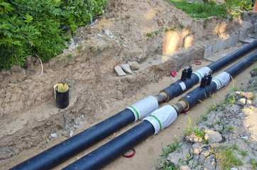 two plastic new heating tube in trench