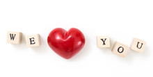 Red Heart And Wooden Cubes With We And You, On White Background. We Love You Concept.