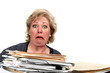 © Jo Ann Snover - Mature woman horrified at the size of a pile of papework