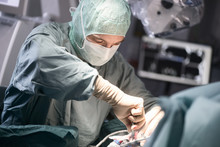 Neurosurgeon Screwing The Cranial Bone During An Operation