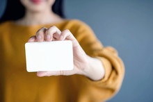 Woman Holding Blank Business Card. White Paper Card For Mockup