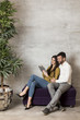 © BGStock72 - Young couple with tablet on sofa
