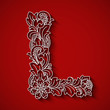 Paper cutting, white letter L . Red background. Floral ornament, balinese traditional style.
