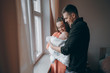 © hetmanstock2 - young family with infant