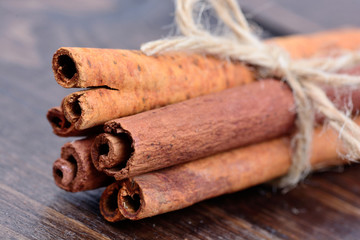 Wall Mural - Group of cinnamon sticks on table