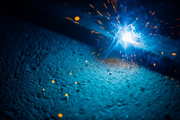 Poster - artistic welding sparks light, industrial background