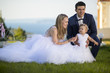 © silalena - Summer wedding with children. Happy bride and groom in wedding day with little daughter.