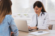 © bnenin - Portrait of a female doctor using her laptop computer at clinic