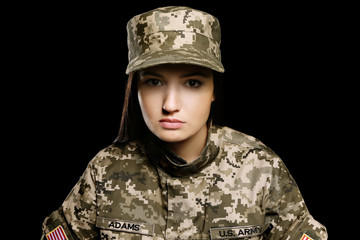 Canvas Print - Pretty female soldier on black background