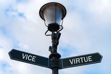 Vice Versus Virtue Directional Signs On Guidepost