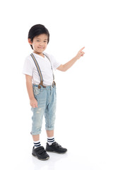 Canvas Print - Asian child  in white t-shirt and jeans pointing