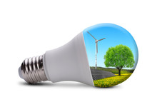 Eco LED Bulb With Solar Panel And Wind Turbine Isolated On White Background. 