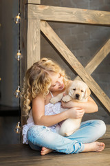 Poster - Little girl with a labrador puppy