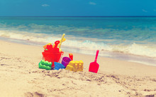 Kid Toys On Tropical Sand Beach