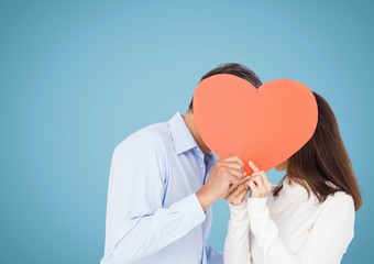 Canvas Print - Romantic couple holding heart shape and kissing each other