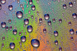 Colorful abstract formed by water droplets on the surface of a cd