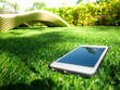 cellphone on a artificial grass field