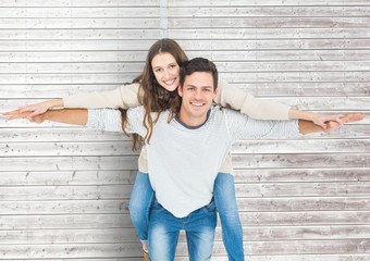 Poster - Man giving a piggyback ride to woman