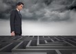 © vectorfusionart - Conceptual image of businessman looking over maze
