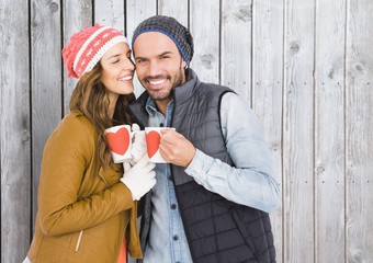 Wall Mural - Romantic couple holding coffee mugs