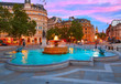 London Trafalgar Square fountain at sunset