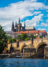 Prague Castle And Wooden Icebreaker That Protects The Pillars Of Charles Bridge From The Winter Ice On The Vltava River In Prague
