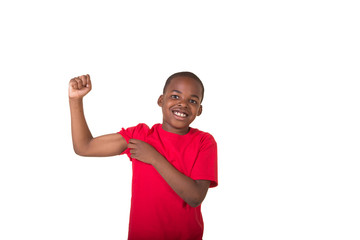 Young boy making a muscle isolated on white