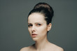 © SHOTPRIME STUDIO - a woman with bare shoulders and a bunch of hair on her head