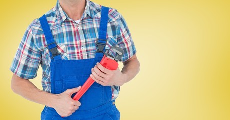 Canvas Print - Mid section of handyman holding pipe wrench