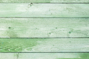 Wall Mural - Natural weathered wooden planks background. Old painted in green